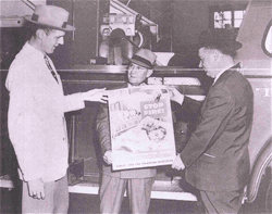 3 Men Holding a Fire Safety Poster